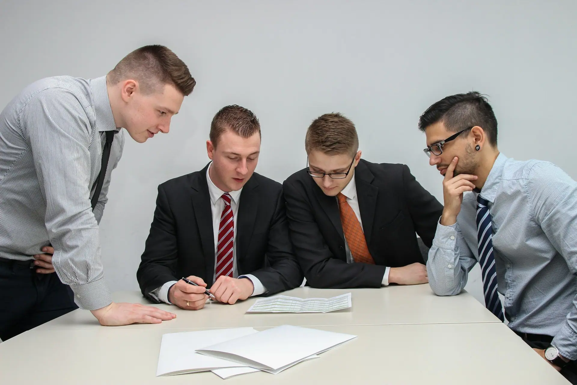 Colleagues reviewing documents together at a table